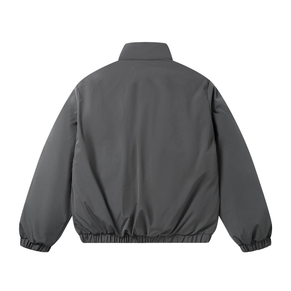 jaqueta bomber cinzenta com bolsos em patchwork.